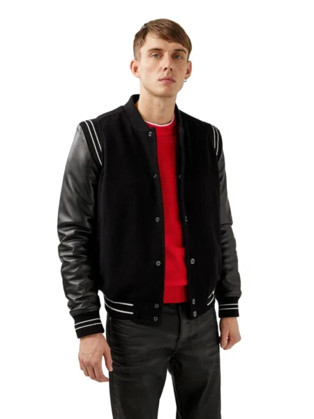 GRAPHITE BLACK VARSITY FLEECE JACKET WITH FAUX LEATHER SLEEVES Varsity Fleece Jackets are a classy and handsome addition to a men’s wardrobe. The Graphite Black Varsity Fleece Jackets with Faux Leather Sleeves is one of the most dashing attire you can wear in all seasons. The jacket features neatly knitted ribbed collar and ribbed cuffs providing the outfit a smart look. It has front styled with button closure that looks simply amazing. The two waist sided pockets add a crunchy look to the jacket. The material used in the jacket is strong and soft fleece with long fitted faux leather sleeves and fine knitted ribbed cuffs at the end of the sleeves. Its black color gives it a bold versatile look. Its fine white lines are made to provide the jacket a fine settled touch. The Graphite Black Varsity Fleece Jacket is the style statement you should wear to carry your desired chic style this winter season. Jacket features: • Costume type : Graphite Black Varsity Fleece Jackets • Material : Soft Durable Fleece • Color : Black • Front : Button Closure • Collar Style: Ribbed Collar • Sleeves: Faux Leather Sleeves • Cuff style: Ribbed Cuffs • Pockets : Two Waist Pockets • Warm and Comfortable